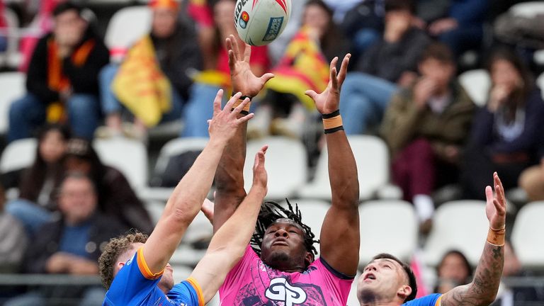 Junior Nsemba of Wigan Warriors collects a cross field kick and scores the second try