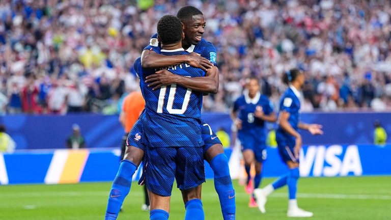 France's Ousmane Dembele congratulates Kylian Mbappe after he scored their second goal during the World Cup Group I match against Iraq
