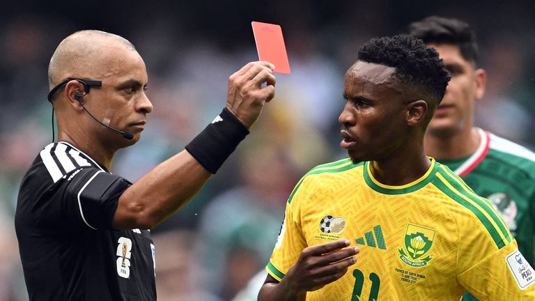 Wilton Sampaio shows a red card to South Africa's midfielderThemba Zwane during the 2026 World Cup Group A match against Mexico