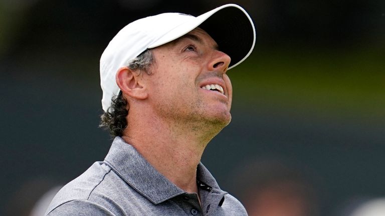 Rory McIlroy, of Northern Ireland, reacts after missing a putt on the third hole during the second round