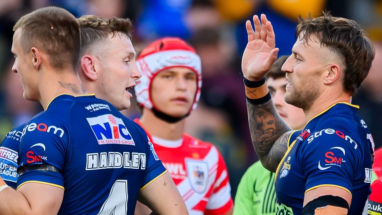 Leeds' Chris Hankinson (r) is congratulated on scoring a try against St Helens