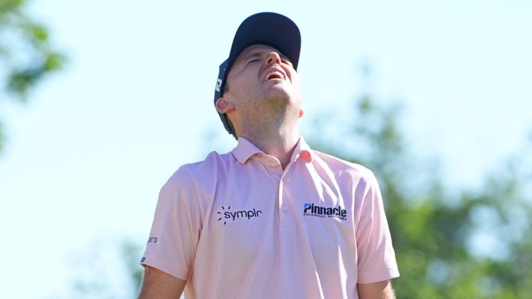 Russell Henley reacts to sinking a putt on the 18th hole to win the Charles Schwab Challenge (AP Photo/LM Otero)