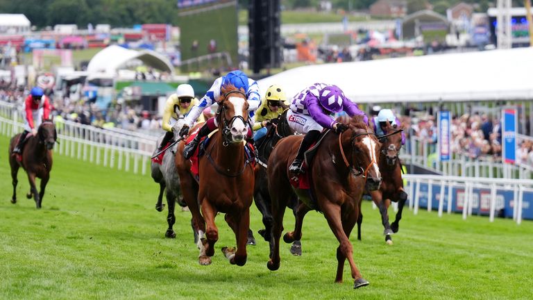 Seagulls Eleven ridden by Oisin Murphy (centre left) on their way to winning the Betfred Diomed Stakes at Epsom Downs