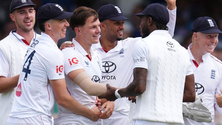 Sonny Baker is congratulated after dismissing Daryl Mitchell