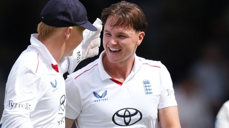 Sonny Baker celebrates taking his second wicket on debut with James Rew