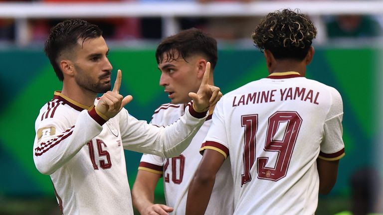 Alex Baena celebrates his opener for Spain against Uruguay in the final game of Group H