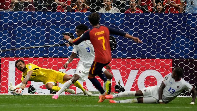 Cape Verde goalkeeper Vozinha makes a save after shot by Spain's Ferran Torres