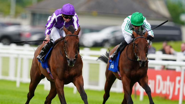 Sun Goddess (centre) ridden by Ryan Moore goes on to win the Airlie Stud Stakes at Curragh racecourse