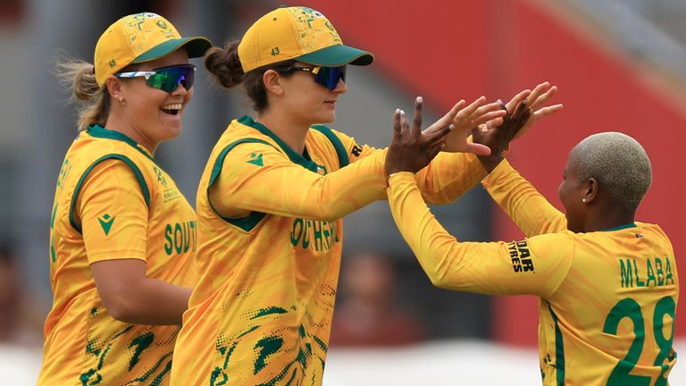 South Africa's Laura Wolvaardt (centre) and Nonkululeko Mlaba celebrate taking the wicket of Australia's Ash Gardner 