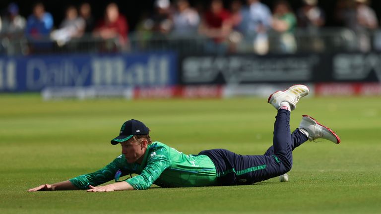 Ireland's Tim Tector dives to save a boundary during the match