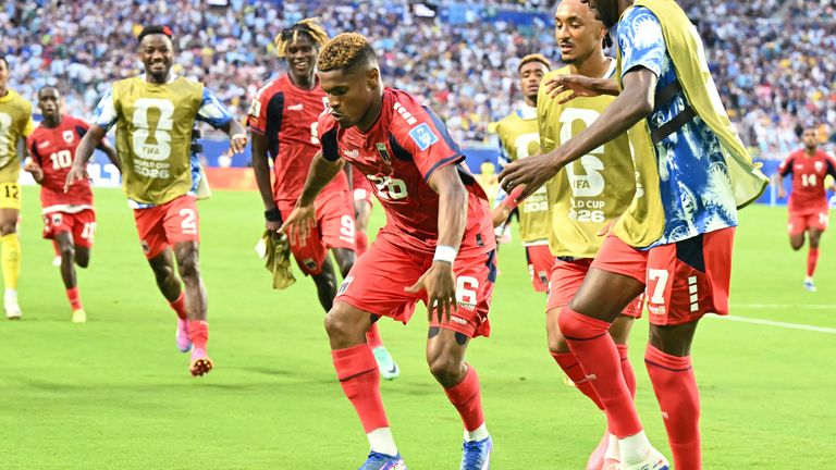  Helio Varela (C) celebrates with teammates after scoring his team's second goal 