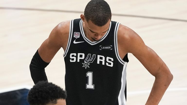 San Antonio Spurs forward Victor Wembanyama takes a moment to himself during Game 1 of the NBA Finals (AP Photo/Eric Gay)