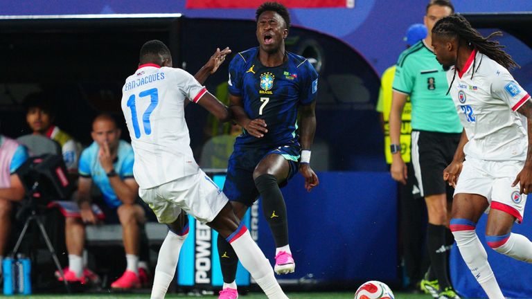 Brazil's Vinicius Junior (7) battles for the ball with Haiti's Danley Jean Jacques (17) during the World Cup Group C 