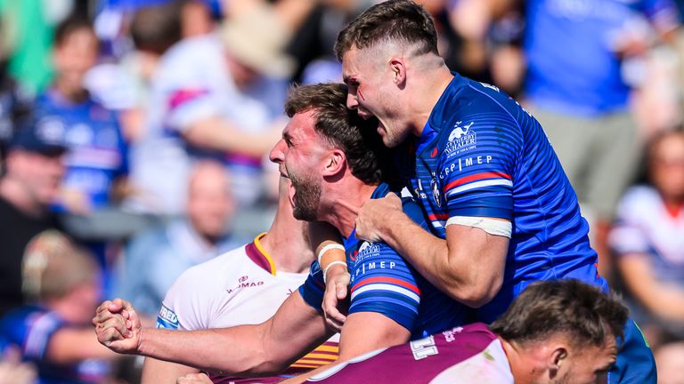 Wakefield's Josh Rourke celebrates scoring the game-winning try as time expires against Huddersfield.