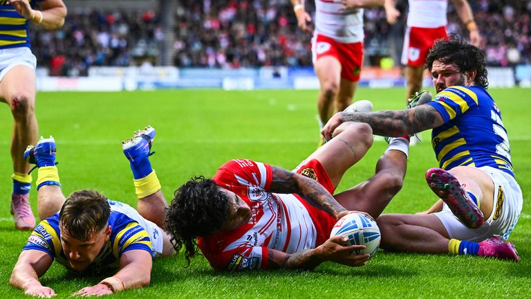  Leon Hayes of Warrington and James Bentley of Warrington fail to stop Tristan Sailor of St Helens from scoring a try