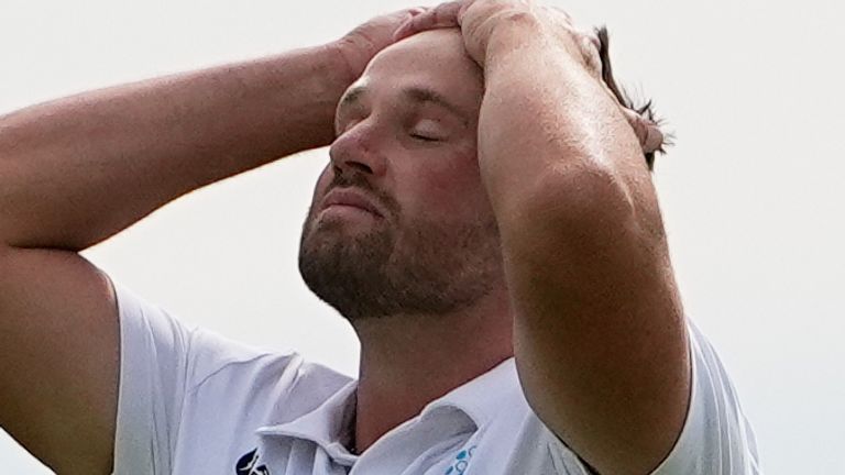 Wyndham Clark reacts after missing a putt on the 14th hole during the second round of the U.S. Open golf tournament at Shinnecock Hills