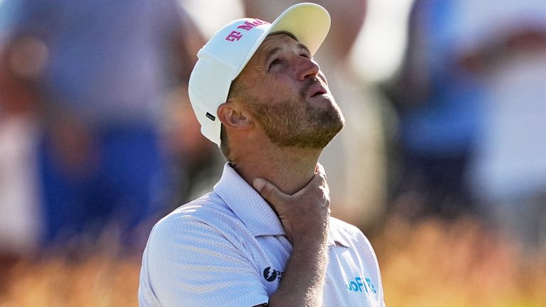 Wyndham Clark reacts to his putt on the 14th hole during the final round of the U.S. Open golf tournament at Shinnecock Hills Golf Club in Southampton, N.Y., Sunday, June 21, 2026. (AP Photo/Gerald Herbert)