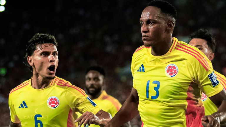 Yerry Mina (right) celebrates scoring in World Cup qualifying for Colombia