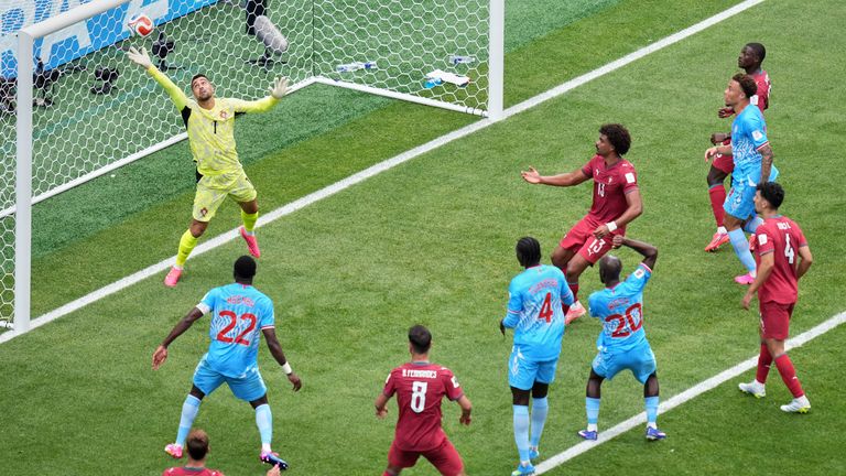 Portugal goalkeeper Diogo Costa (1) fails a headed goal by Congo's Yoane Wissa (20) during the World Cup Group K soccer match between Portugal and Congo in Houston, Wednesday, June 17, 2026. (AP Photo/Eric Smith)