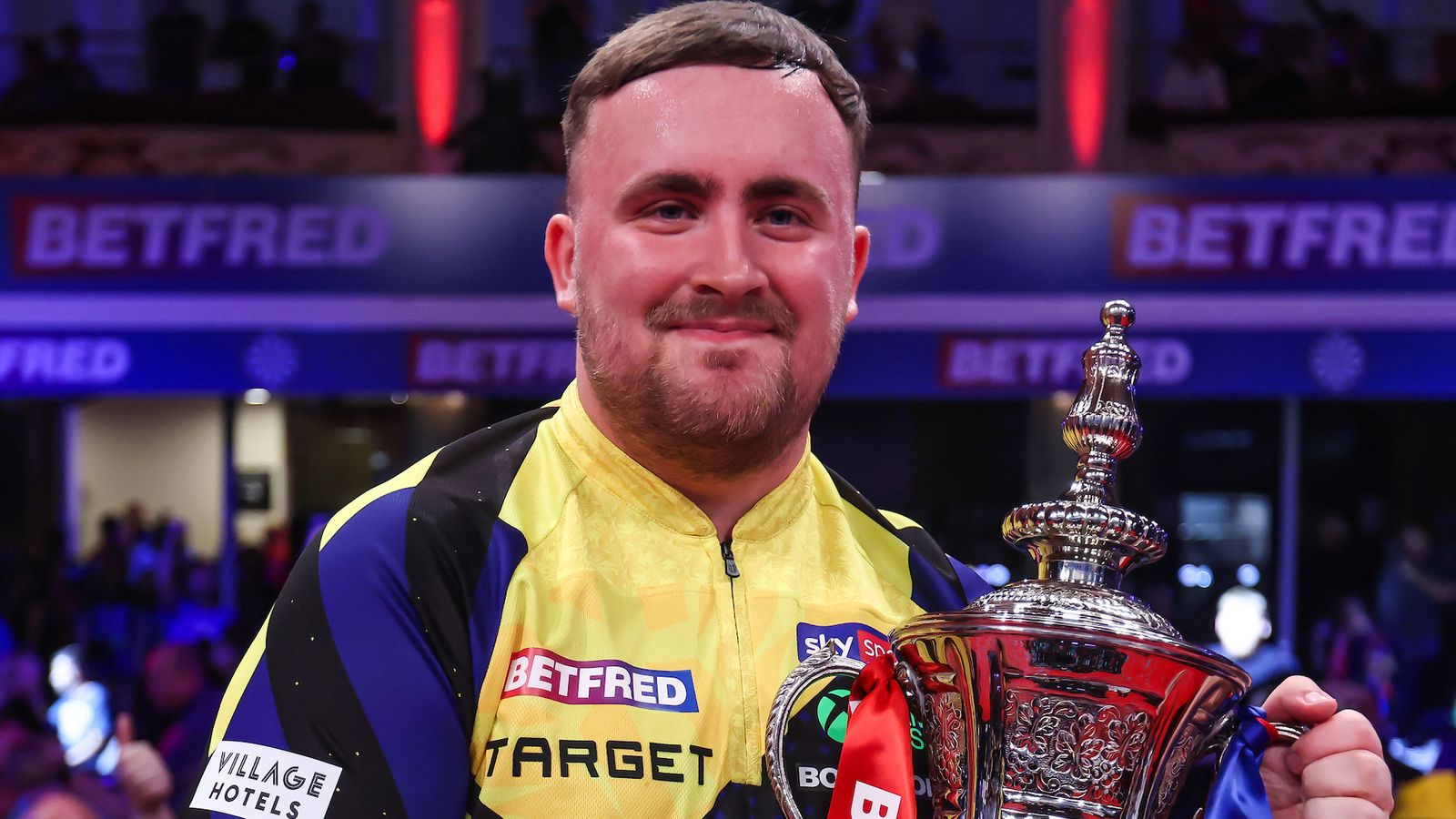World Matchplay Darts: Luke Littler thrashes Gerwyn Price 18-9 to defend title with record-breaking display in Blackpool