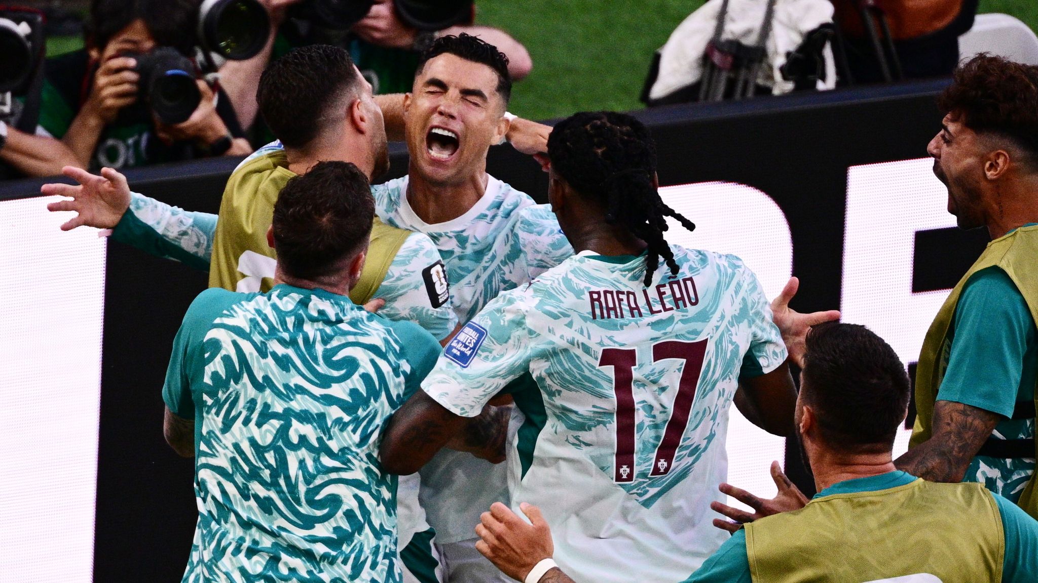 Portugal's Cristiano Ronaldo (7) celebrates with teammates after scoring their first a goal on a penalty kick during the World Cup round of 32 soccer match between Portugal and Croatia in Toronto, Thursday, July 2, 2026. (Sammy Kogan/The Canadian Press via AP)