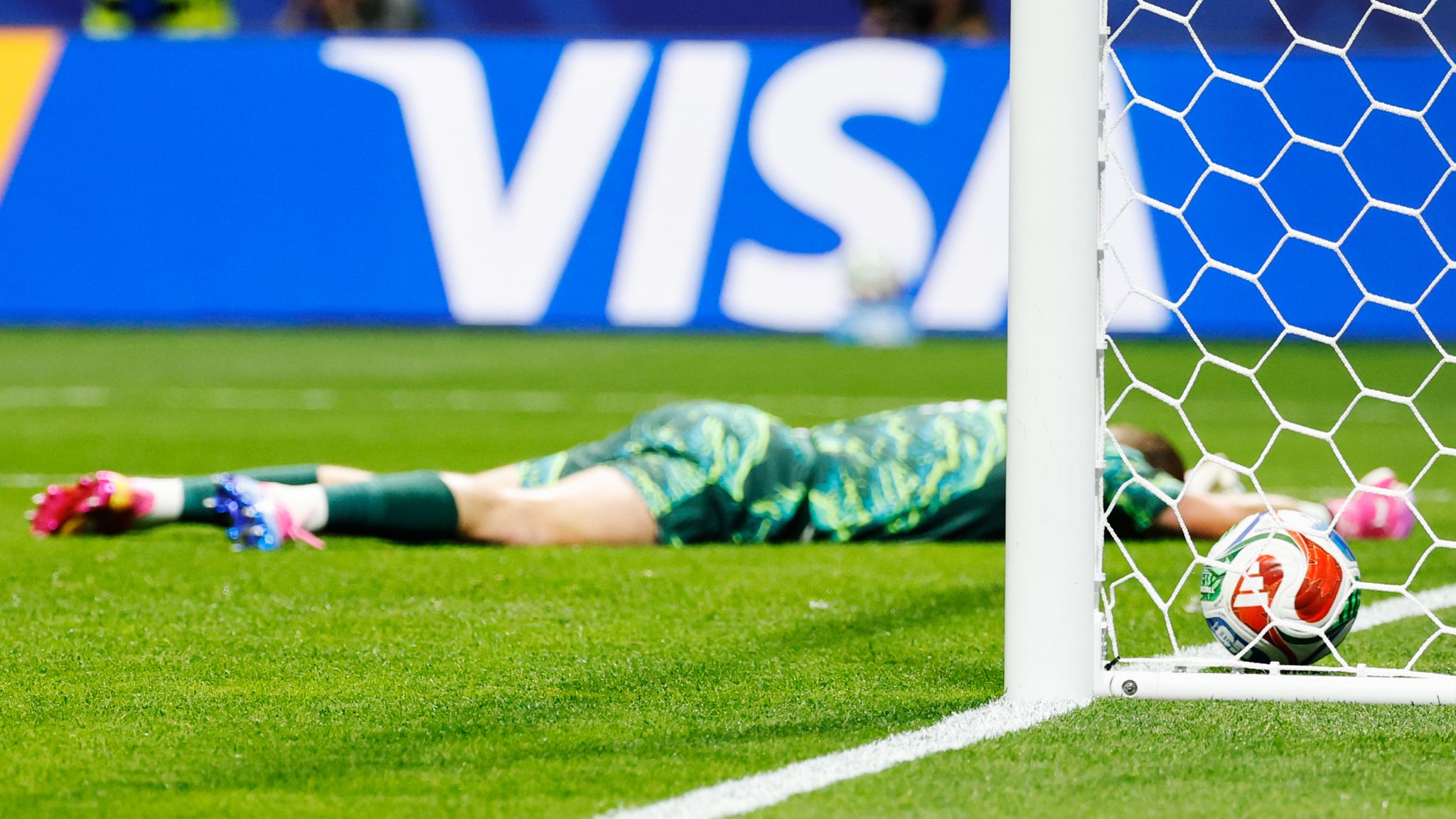 England goalkeeper Jordan Pickford lies face down on the pitch after DR Congo's Brian Cipenga opens the scoring (AP Photo/Erik S. Lesser)
