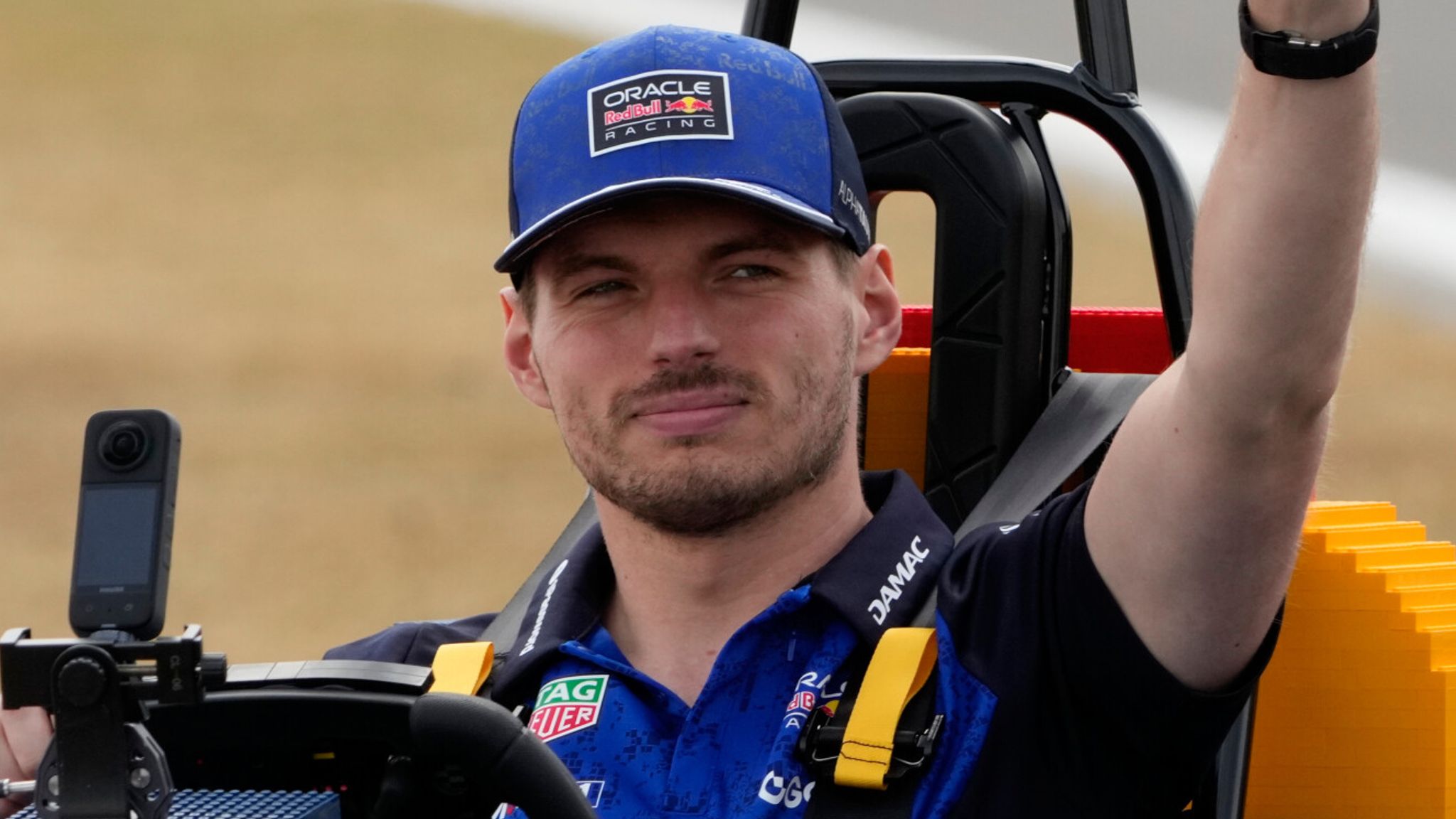 Max Verstappen looking frustrated at the British Grand Prix