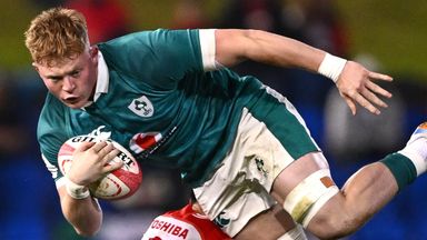 Bryn Ward of Ireland is tackled by Naoto Saito of Japan during the Nations Championship rugby international