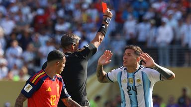 Referee Slavko Vincic, of Slovenia, gives a red card to Argentina's Enzo Fernandez (24) as Spain's Pedro Porro (12) looks on during the World Cup final soccer match between Spain and Argentina in East Rutherford, N.J., near New York, Sunday, July 19, 2026. (AP Photo/Pamela Smith)