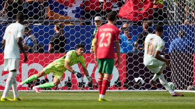 Morocco goalkeeper Yassine Bounou dives to stop a penalty shot by France's Kylian Mbappe, right, during the World Cup quarterfinal soccer match between France and Morocco in Foxborough, Mass., near Boston, Thursday, July 9, 2026. (AP Photo/Matt Slocum)