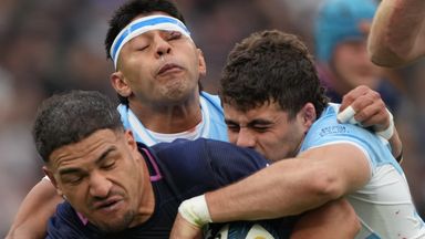 Scotland's Sione Tuipulotu is tackled by Argentina's Faustino Sanchez Valarolo and Gonzalo Garcia