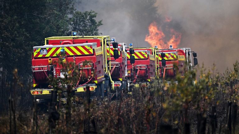Firefighters tackle a blaze as wildfires rage near Le Las, outside Bordeaux. Pic: AP