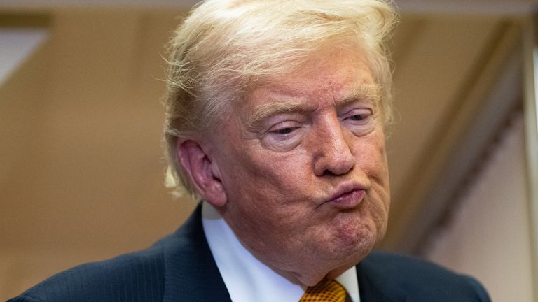 President Donald Trump listens to a question as he speaks with reporters in flight on Air Force One after landing at U.S. Air Force Base at RAF Mildenhall, in Suffolk, Eastern England, Wednesday, July 8, 2026. (AP Photo/Alex Brandon)