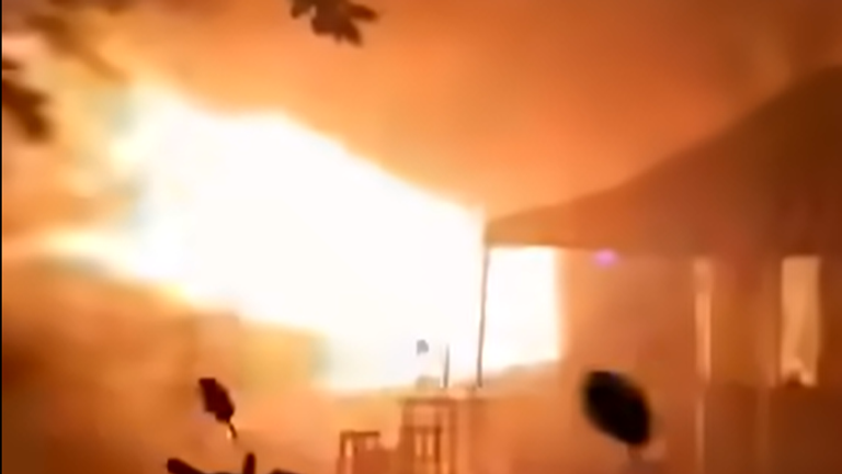 Flames burst out of a pub in Lat Phrao, northern Bangkok, Thailand. Pic: Fire & Rescue Thailand