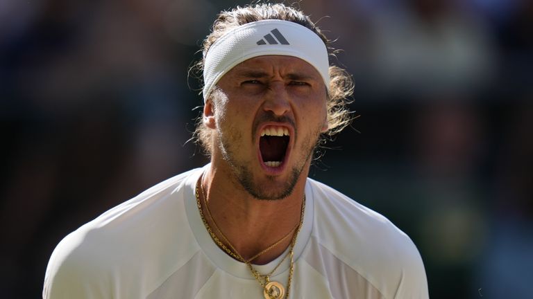 Alexander Zverev of Germany celebrates winning the first set against Jannik Sinner of Italy in the men's singles final at Wimbledon Tennis Championships in London, Sunday, July 12, 2026. (AP Photo/Kirsty Wigglesworth)