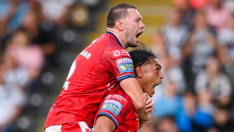 Hull KR's Tom Amone celebrates his try against Hull FC with James Batchelor..