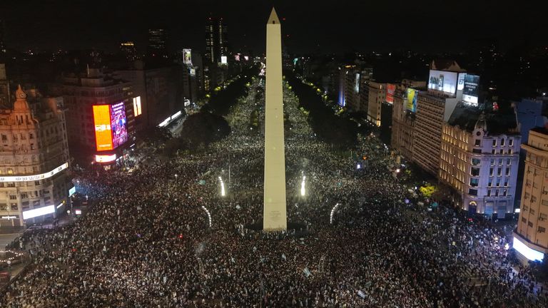 Fans celebrate Argentina's victory over England in a World Cup semifinal soccer match around the Obelisk in downtown Buenos Aires, Argentina, Wednesday, July 15, 2026. (AP Photo/Rodrigo Abd)