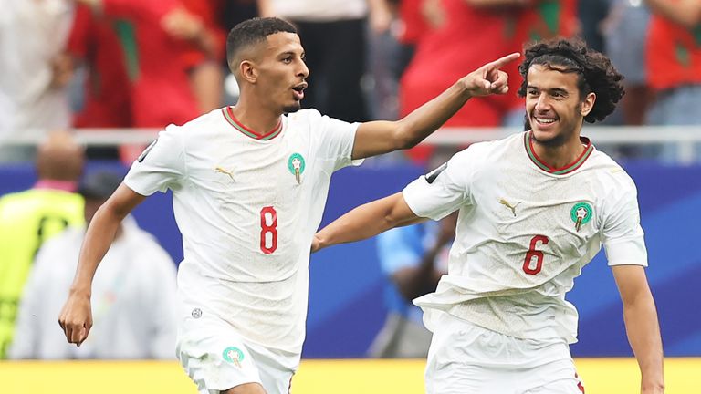 Morocco's Azzedine Ounahi celebrates with team-mate Ayyoub Bouaddi after scoring the opening goal in the Last 16 tie against Canada