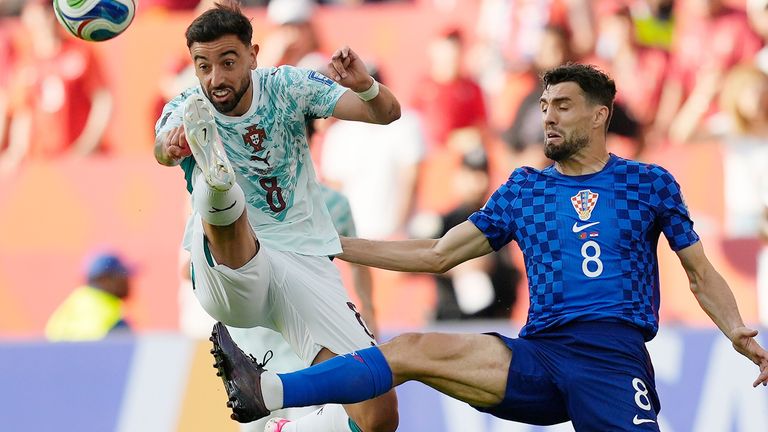 Portugal's Bruno Fernandes (8) battles with Croatia's Mateo Kovacic (8) during the World Cup round of 32 soccer match between Portugal and Croatia in Toronto, Thursday, July 2, 2026. (AP Photo/Mike Stewart)