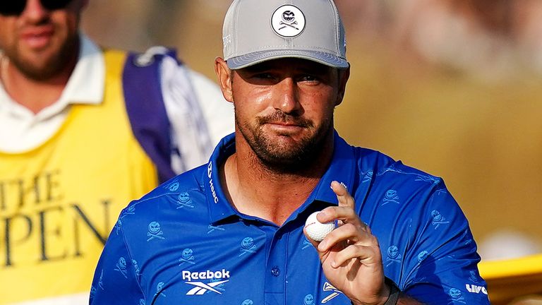Bryson DeChambeau will play on after he was controversially penalised two strokes for improving lie during his second round at The Open