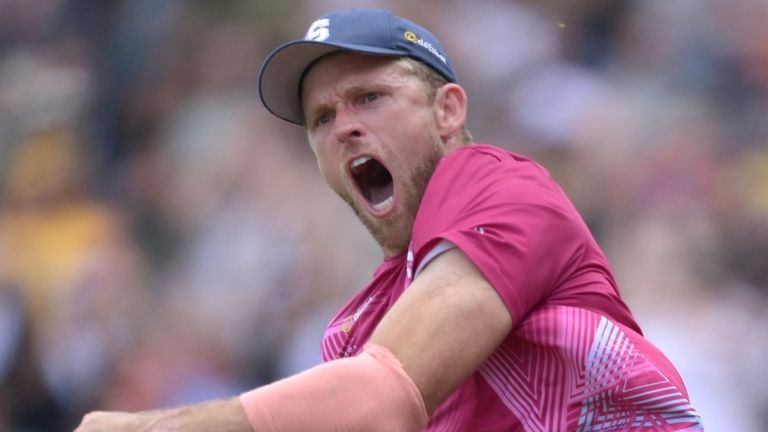 David Willey (left) and Saif Zaib (right) celebrate after combining to take a spectacular catch on the boundary for Northamptonshire