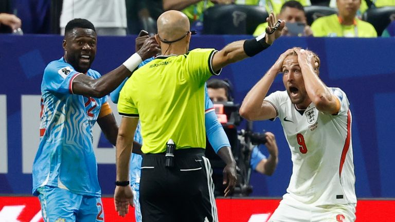 England's Harry Kane cannot believe a penalty wasn't given