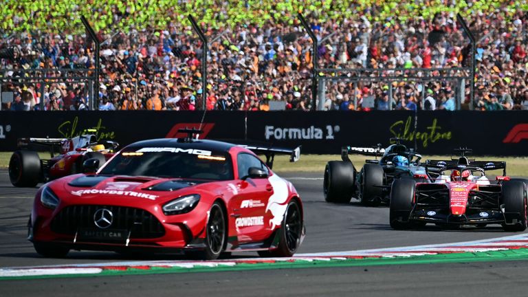 Charles Leclerc and George Russell behind the Safety Car at the British Grand Prix (Photo by Ben STANSALL / AFP)