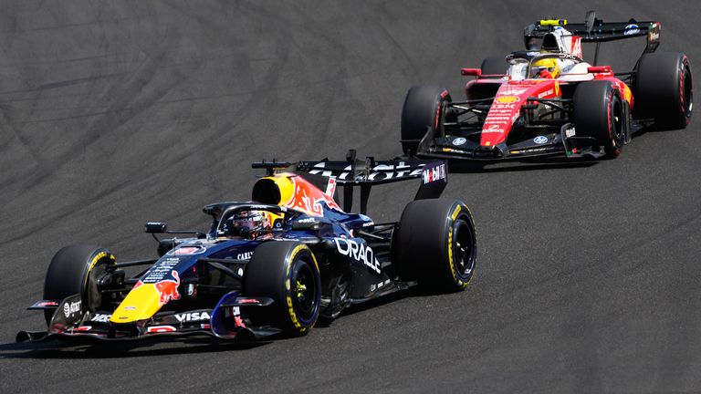Max Verstappen and Lewis Hamilton battling at the Hungarian GP (AP Photo/Darko Bandic)