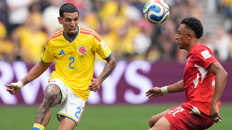 Colombia's Daniel Munoz and Switzerland's Dan Ndoye 
