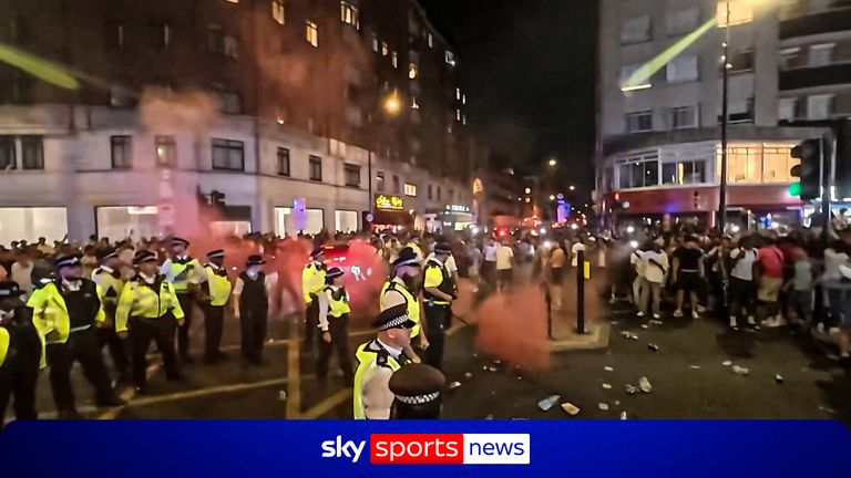One officer has been injured and four people arrested in London after fans clashed with police following France's 2-0 win over Morocco.