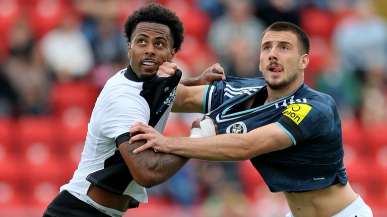 Gateshead's Ashley Boatswain (left) and Newcastle United's Miodrag Pivas battle for the ball during the pre-season friendly match