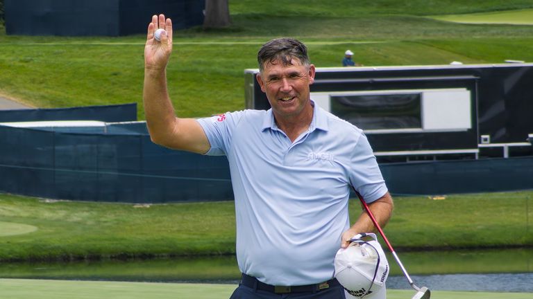 Padraig Harrington salutes the crowd after finishing his round 