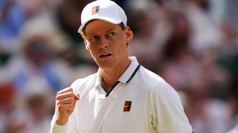 Jannik Sinner celebrates a point against Novak Djokovic at Wimbledon