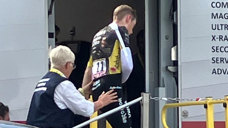 Jonas Vingegaard (right) gets into an x-ray van after his crash (Stefan Tabeling/picture-alliance/dpa/AP Images)